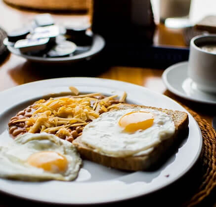 loaf of bread with two eggs and beans