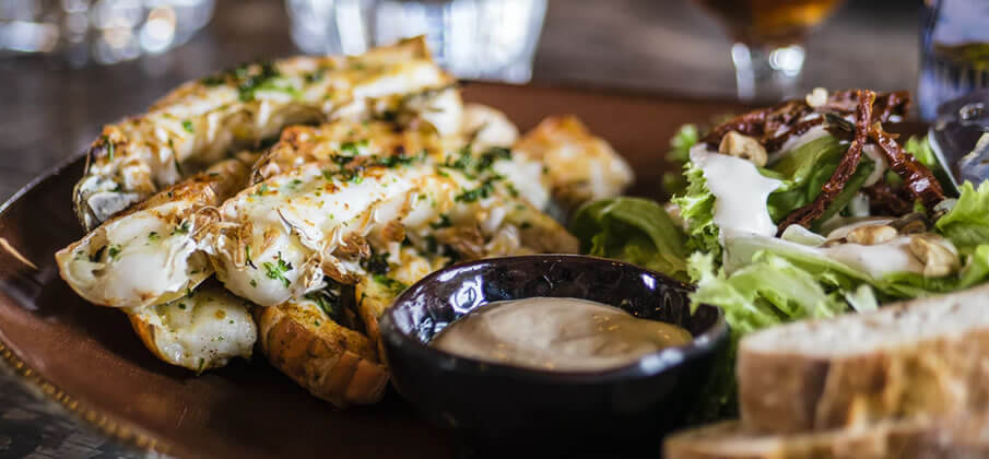 cheese roll and salad on a plate