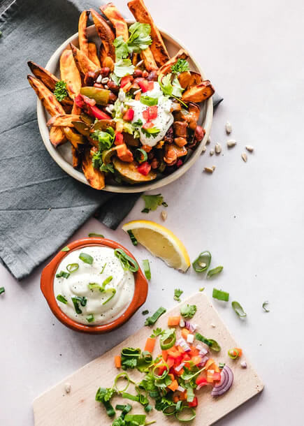 french fries with a dip beside the plate